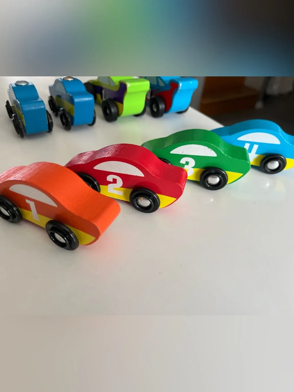 8 wooden racing cars.   Cars Number 1-4 are Melissa & Doug.
